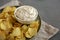 Crispy Crinkle Potato Chips and French Onion Dip on a Plate, side view. Copy space