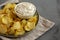 Crispy Crinkle Potato Chips and French Onion Dip on a Plate, side view. Space for text