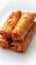 Crispy deep fried spring roll on white background, perfect appetizer