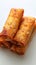 Crispy deep fried spring roll on white background, perfect appetizer