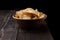 Crispy delicious pepper crisps in wooden bowl