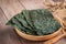 Crispy dried seaweed on wooden plate