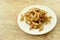 Crispy fried anchovy fish with salt on plate