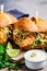 Crispy fried chicken sandwiches with coleslaw salad on the board