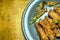 Crispy fried chicken wing with lemon grass on plate