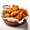 Crispy fried chicken wings with tomato ketchup on a bowl in white background