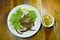 Crispy fried minced catfish with green mango salad and sauce