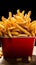 Crispy fries in a red fast food box, isolated