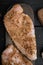 Crispy garlicky chicken raw ingredients, on black wooden background, top view