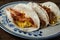 Crispy glazed bacon and fried eggs breakfast tacos