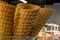 Crispy golden empty ice cream cones one over another, in a candy shop, during fast food festival