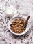 Crispy granola muesli with dried fruits, nuts and seeds and a jar of yogurt