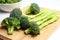 crispy, green broccoli florets on a white chopping board