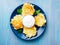 Crispy hashed browned potatoes on blue background, top view.