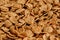 Crispy healthy dry cereal flakes as a background texture