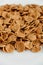 Crispy healthy dry cereal flakes on white background