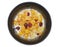 Crispy and healthy organic breakfast cereal flakes with red dried cranberry and cold soy milk in dark black handmade pottery bowl