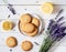 Crispy, homemade cookies with lavender and lemon peel, on a white wooden table