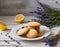 Crispy, homemade cookies with lavender and lemon peel, on a white wooden table