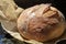 Crispy just baked Sourdough bread loaf resting after just being baked in oven