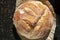 Crispy just baked Sourdough bread loaf resting after just being baked in oven