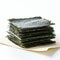 Crispy nori seaweed on white background. Dry japanese organic seaweed