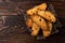 Crispy rusk on dark wooden background