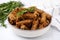 Crispy rusks with rosemary on white tiled table