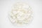 Crispy shrimp chips on a white background. Prawn cracker krupuk in a bowl top view