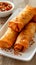 Crispy spring roll with savory sauce, perfect appetizer or snack