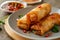 Crispy spring roll with savory sauce, perfect appetizer or snack