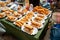 Crispy spring rolls on white paper dish, sell on stall at Thai Park, open air market, in Berlin, Germany.