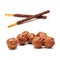 Crispy sweet straw covered chocolate and ball with crushed nuts