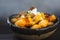 Crispy tater tots doused mercilessly in spicy jalapeno cheese sauce, maple-glazed bacon and sour cream.  Finished with a splash of