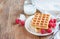 Crispy wafers with cream and fresh raspberries for