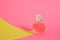 cristal glass perfume bottle on pink background