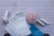 Critical days. Menstruation pads, hygiene items - pads, panty liners and white tampons on a wooden background. Hygiene Bag - Blue.