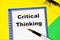 Critical thinking. The text label in the notebook.