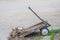 Critically Damaged Wooden Cart on the Side of the Road