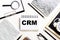 CRM customer relation management abbreviation on blue paper