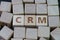 CRM, Customer Relationship Management, loyalty program, repeat purchase frequency concept, cube wooden block with alphabet combine