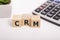 CRM, Customer Relationship Management, loyalty program, repeat purchase frequency concept, cube wooden block with alphabet combine
