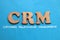 CRM Customer Relationship Management  text words typography written on blue background  life and business motivational