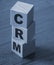 CRM, Customer Relationship Management on wooden blocks. Business concept