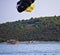 Croatia, Ciovo island - two girls and a boy enjoying sea parachute
