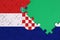 Croatia flag is depicted on a completed jigsaw puzzle with free green copy space on the right side