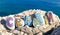 Croatia inscription made of painted stones on rocks, sea background