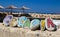 Croatia inscription painted on stones, straw umbrellas in the background