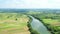 Croatia, Kupa river meandering between agriculture fields, shot from drone