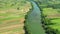 Croatia, Kupa river meandering between agriculture fields, shot from drone